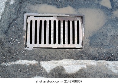 A Sewer Grate In The Street