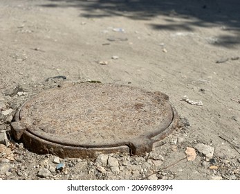 Sewer Hatch In The Ground.