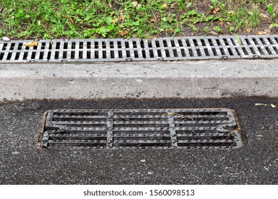 Sewer Manhole Grille On Asphalt Road Stock Photo 1560098513 | Shutterstock