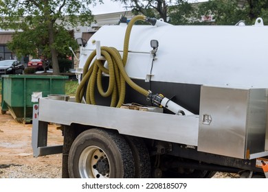 The The Sewer Pumping Machine Septic Vacuum Waste Truck Is In The Process Of Cleaning The Portable Restrooms