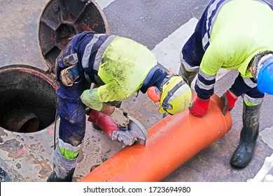 Sewer  Utility Worker For Cleaning And Repairing Sewerage Pipes  In Construction Site