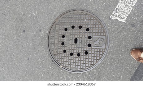 Sewerage manhole cover of cast iron in Bern, Switzerland