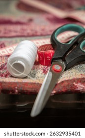 sewing accessories. Needle with threads. Scissors. Centimeter. Thimble