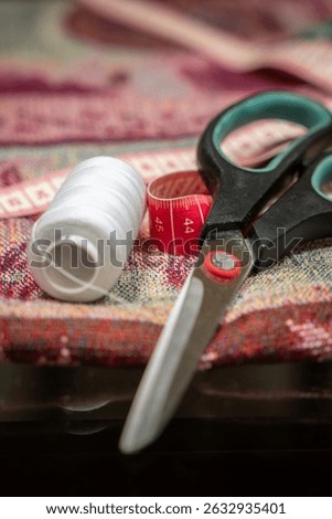 sewing accessories. Needle with threads. Scissors. Centimeter. Thimble