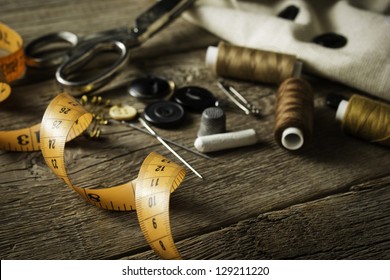 Sewing accessories on wooden table - Powered by Shutterstock