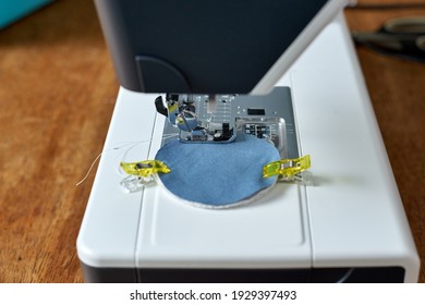 Sewing at home with a sewingmachine