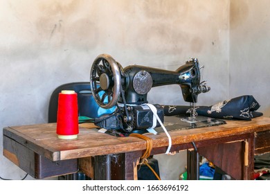 Sewing Machine And African Fabrics In Seamstress Workshop, Mozambique, Africa