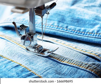 Sewing Machine And Blue Jeans Fabric.