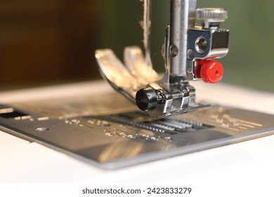 Sewing machine close up - needle, needle plate and foot. - Powered by Shutterstock