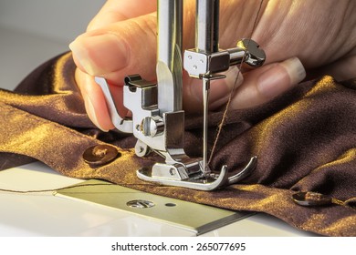sewing machine and item of clothing - Shutterstock ID 265077695