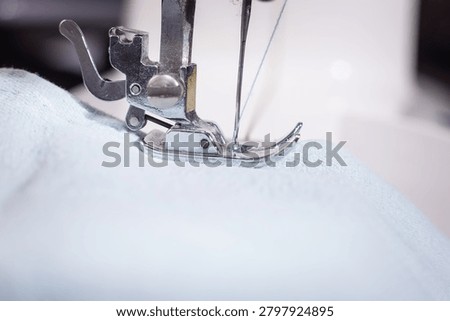 Sewing machine needle stitching white fabric, sewing, needlework