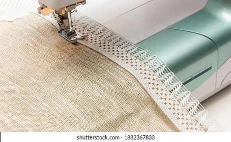 Sewing Machine On The Table Close-up. Freelance. Sewing Of Linen Curtains..