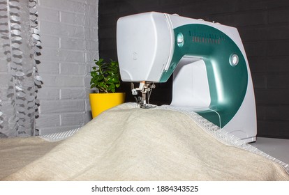 Sewing machine on the table close-up. Freelance. natural fabric.