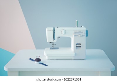 Sewing machine on table in tailor's workshop - Shutterstock ID 1022891551