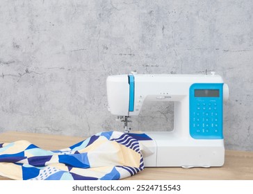 Sewing machine on table in workshop