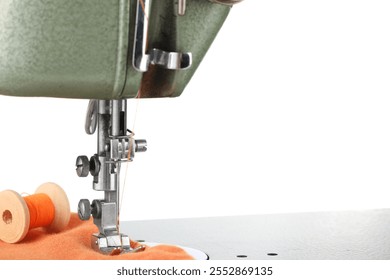 Sewing machine with orange fabric and spool of thread isolated on white - Powered by Shutterstock