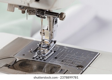 Sewing machine, stitching fabrics, needle in a round plan close up - Powered by Shutterstock