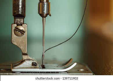 Sewing machine and thread rolling. - Powered by Shutterstock