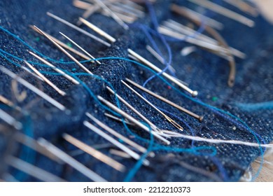 sewing needle quilted in a piece of blue jean