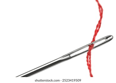 Sewing needle with red thread isolated on white, closeup