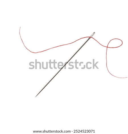 Sewing needle with red thread isolated on white