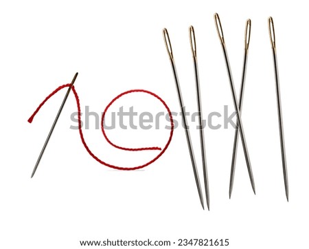 sewing needles on a white background and a sewing needle with thread