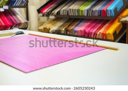 Sewing pattern and scissors for cutting out fabric for sewing.