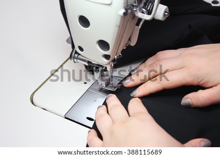 Sewing Process - Women's hands behind her sewing
