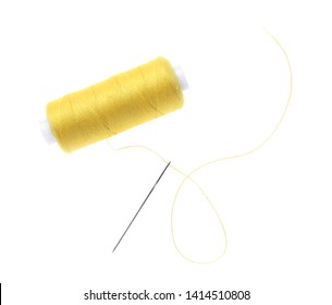 Sewing Thread And Needle On White Background