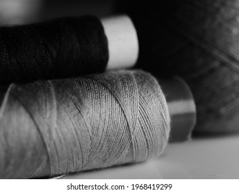 Sewing threads multicolored background closeup, selective focus, macro