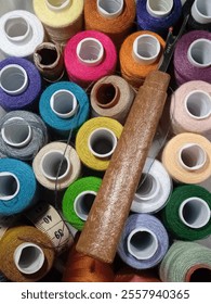 Sewing tools and threads stack together 