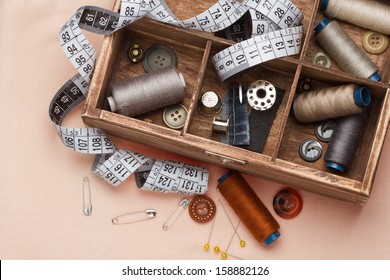  Sewing tools in a wooden box - Shutterstock ID 158882126