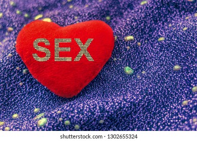 Sex On Red Heart On Neon Backgrond. Love Or Sex.