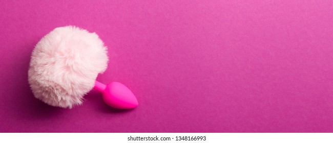 Sex Toy For Adult On Pink Background.