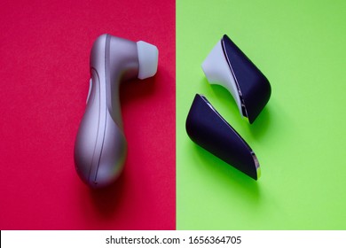 Sex toys. Two vibrators for clitor on a red-green background. Useful for sex shop, adult