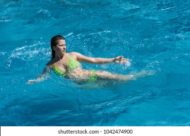 Sexi lady swim on big waves of water 