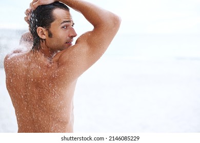 Sexiness Is Next To Cleanliness. Shot Of A Handsome Young Man Enjoying A Refreshing Shower.