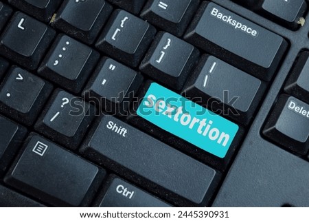 Sextortion write on keyword isolated laptop background
