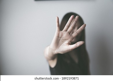 sexual abuse for women gender in society, a girl hand is stopping harassment on the bedroom of family. stop violence against Women, international women's day