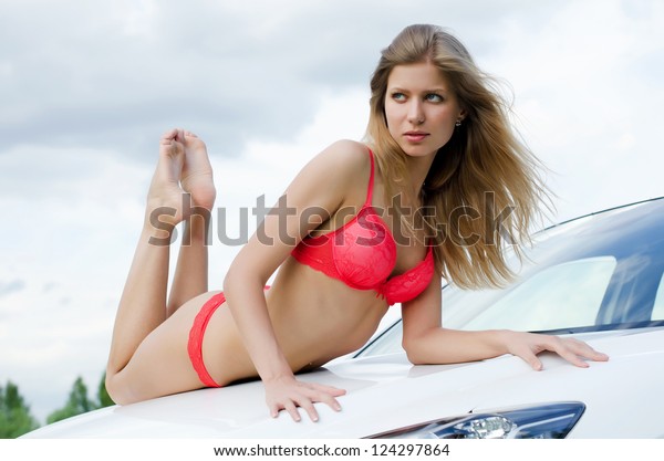 The sexual girl in bikini\
with car