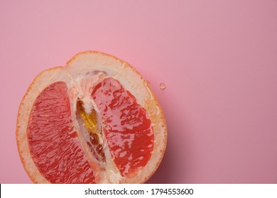 Sexual Grapefruit On Pink Background