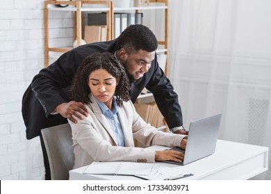 Sexual Misconduct In Office. Boss Touching Shoulder Of His Disgusted Female Colleague At Workplace. Panorama