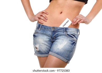 The sexual woman in jeans. Business a card from its jeans. On the isolated white background.