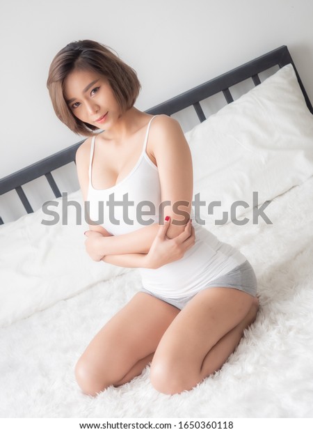 Sexy Asian Woman Lying On Bed Shutterstock