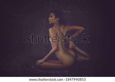 Sexy Asian women sitting on in yoga postures,Dark light