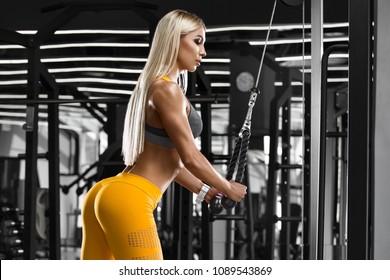 Sexy athletic girl workout in gym. Fitness woman doing exercise. Sexy buttocks in leggings