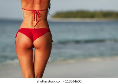 Sexy Back Of A Beautiful Woman In Red Bikini On Sea Background