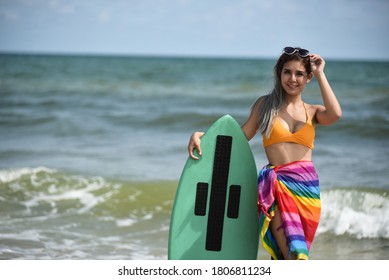 Sexy Beautiful Asian Surfer Woman In Bikini Swimwear With Surfboard On The Beach/Extreme Sport On Summer Holiday Vacation