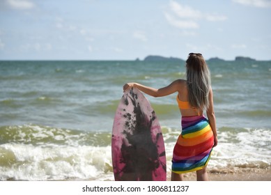 Sexy Beautiful Asian Surfer Woman In Bikini Swimwear With Surfboard On The Beach/Extreme Sport On Summer Holiday Vacation