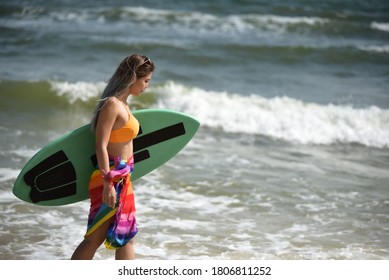 Sexy Beautiful Asian Surfer Woman In Bikini Swimwear With Surfboard On The Beach/Extreme Sport On Summer Holiday Vacation